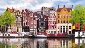 Amsterdam canals and bicycles with historic buildings