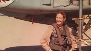 Captain Kim Campbell, U.S. Air Force A-10 pilot, standing next to her aircraft after a combat mission.