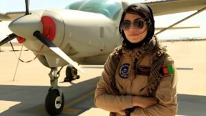 Niloofar Rahmani, the first female fixed-wing pilot in the Afghan Air Force, standing in her military uniform.